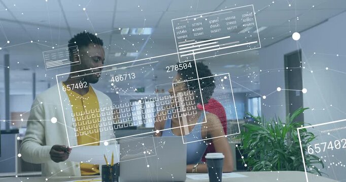 Man and woman pointing printed sheet and producing data panels over laptop for business review