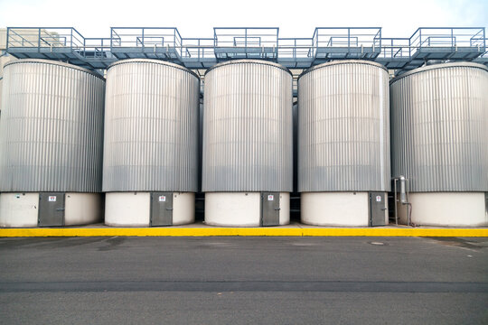 large industrial fermentation tanks at brewery