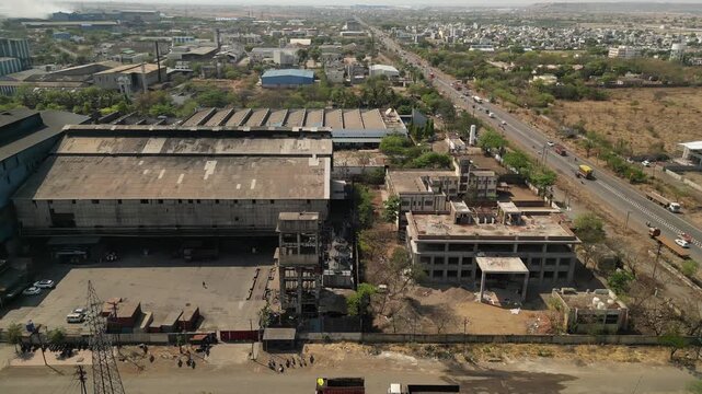 Steel industry ner by mumbai to nagpur highway drone moving wide to closeup view.