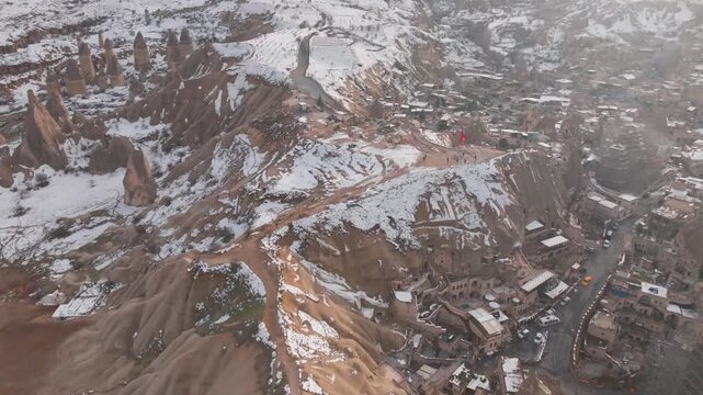 Flyover Town Of G&ouml;reme During Winter In The Cappadocia Region Of Turkey. Aerial Shot