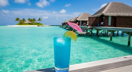 Naklejka premium Tropical cocktail with ocean view with overwater bungalows in the Maldives.