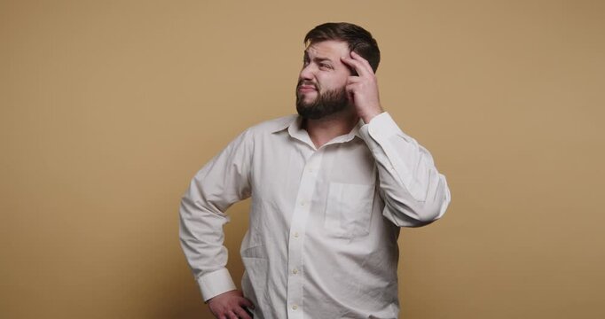 Confused man shows a range of expressions while pondering a difficult question in a cozy studio setting