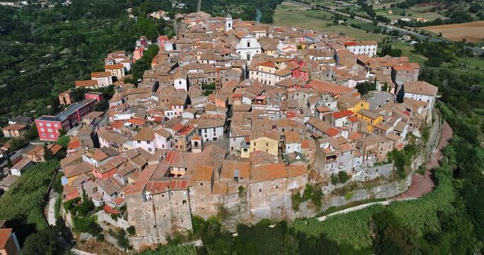 Aerial perspective Orte town skyline Italy. Historic buildings houses church towers surrounded dense summer forest. Beautiful italian countryside travel exploration scene. Viterbo province heritage