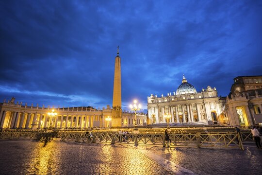 St. Peter's Square with St. Peter's Basilica and obelisk, clouds, dusk, Vatican City, Rome, Italy