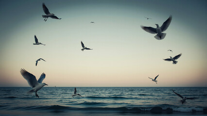 Fototapeta premium Seagulls flying over calm ocean water at dusk