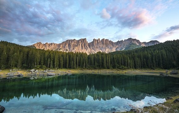 Latemar Group reflected in the Lake of Carezza, Lago di Carezza,  Mountain peaks Eastern Latemar Peak, Diamond Tower, Col Coron,  Catfish furnace, Bolzano, South Tyrol, Italy