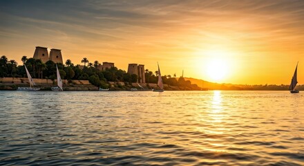 Fototapeta premium River scene with ancient structures under a golden sunset, sailing boats on water
