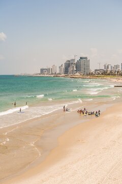 People on the beach, Alma Beach, view of skyline of Tel Aviv with skyscrapers, Tel Aviv, Israel