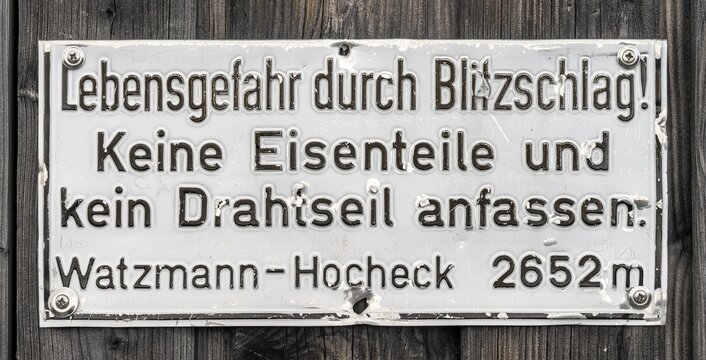 Danger to life due to lightning strike on via ferrata, danger of wire ropes during thunderstorms in the mountains, sign on Watzmann, Berchtesgaden, Bavaria, Germany