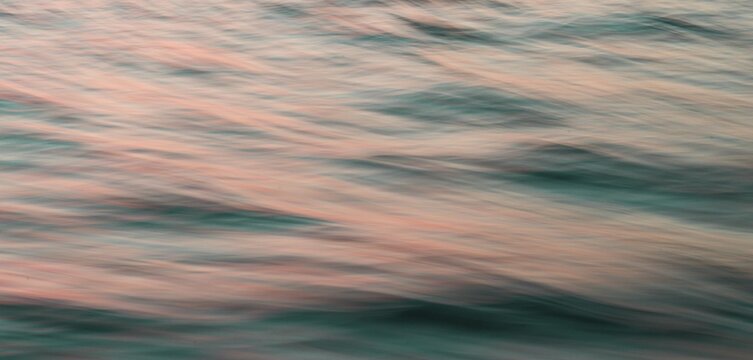 Ocean at sunrise, ocean surface, time exposure