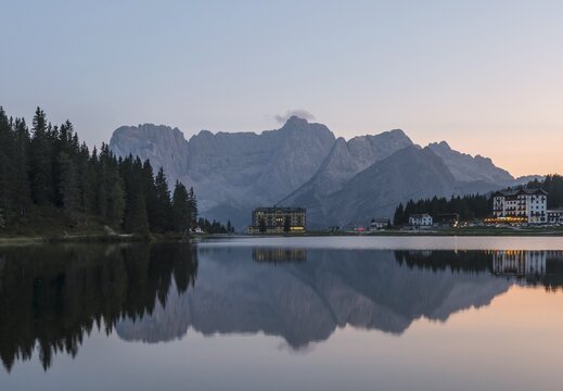 Lake Misurina at sunset, behind medical clinic Istituto Pio XII, Sorapis mountain group, Dolomites, South Tyrol, Bolzano, Italy
