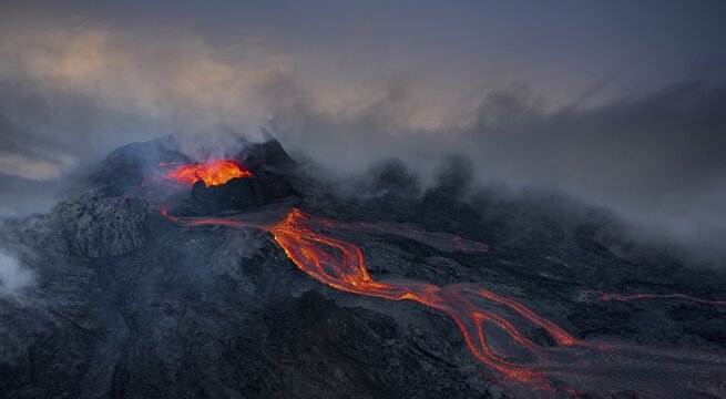 Aerial view, erupting volcano with lava fountains and lava field, crater with erupting lava and lava flow, Fagradalsfjall, Reykjanes Peninsula, Iceland