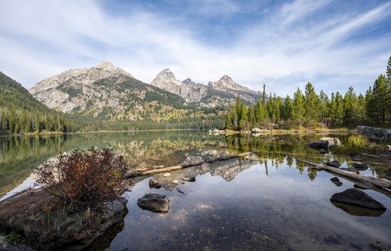 Reflection in Taggart Lake, view of the Teton Range, peaks Grand Teton and Teewinot Mountain, Grand Teton National Park, Wyoming, USA