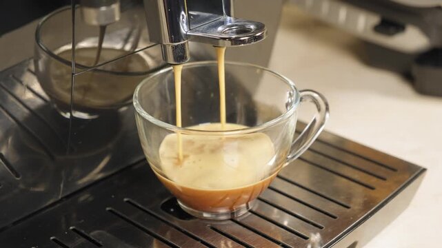 Making coffee using an coffee machine in a kitchen during morning hours