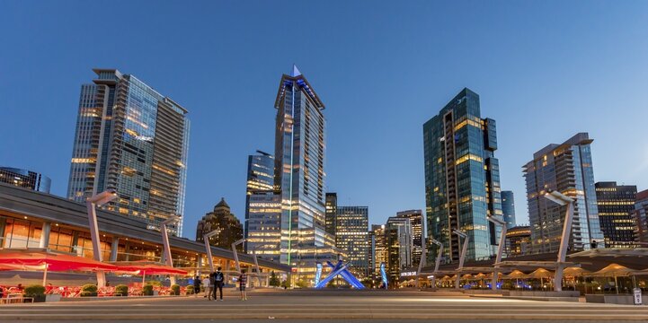Place Jack Poole Plaza with a statue, Olympic Cauldron, skyscrapers at the promenade, evening mood, Coal Harbour, Vancouver, British Columbia, Canada