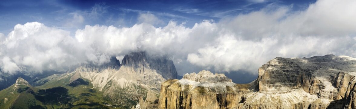 Panoramic view of the Langkofel massif, partially shrouded in clouds, and the Sella massif from Mount Sass Pordoi, Canazei, Val Gardena, province of Bolzano-Bozen, Italy, Europe