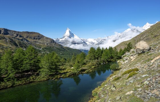 View over Lake Grindij with snow-covered Matterhorn, 5 lakes hiking trail, Valais, Switzerland