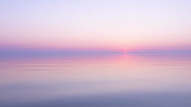 Tranquil sunrise over calm water soft colors and atmospheric beauty
