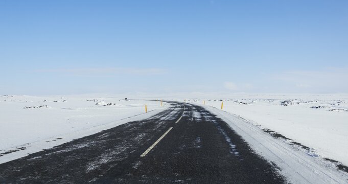 Road through snowy landscape, ring road, National Highway 1 or Hringvegur, North Island, Island