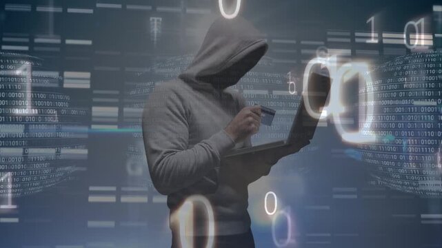 Animation of binary code and data processing over hacker using laptop