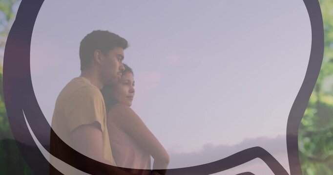 Animation of speech bubble over happy couple embracing