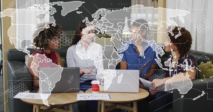 Animation of world map and data processing over business people using laptops