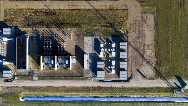Aerial view of Windplan Groen substation featuring electrical transformers and energy storage units in Dronten, Flevoland, Netherlands.