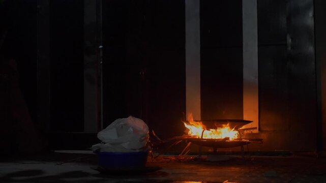 Making drink Talaa Amharic Ethiopian local traditional drink wide shot windy night