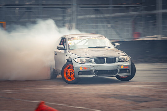 Riga, Latvia 2026-03-28  Sports car performing a drift maneuver on an indoor track