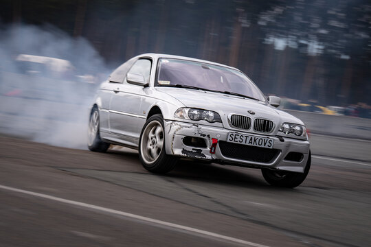 Riga, Latvia 2026-03-28  Fast-paced race car on a track with tire smoke