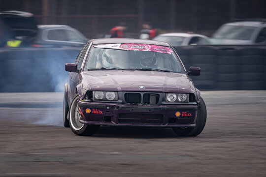 Riga, Latvia 2026-03-28  Sport Sedan Drifting on Asphalt Road