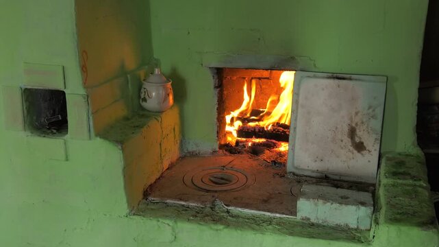 Bashkir village, a firewood burning in the village furnace.