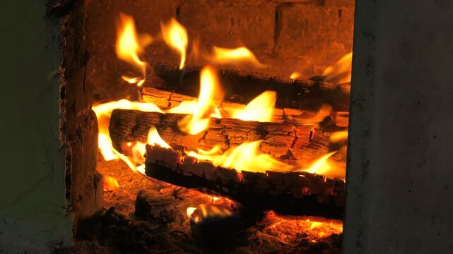 Bashkir village, a firewood burning in the village furnace.