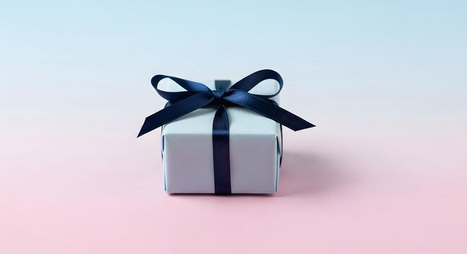 Elegant gift box with dark ribbon a celebration of giving description a small square gift box wrapped in light