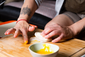 Obraz premium Preparing Vietnamese spring rolls on kitchen table, homemade cooking process