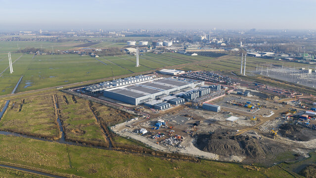 Groningen, Netherlands - 20 January 2026: Aerial view of Datacenter Westpoort with industrial infrastructure and green fields under a clear sky.