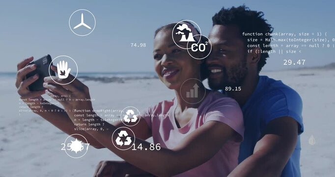 woman and man taking selfie on beach, showcasing environment tech with floating eco icons and data