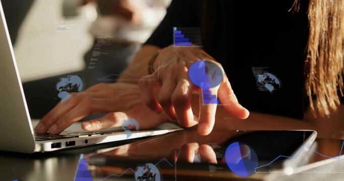 Woman tapping and dragging tablet while typing laptop, activating tech pie charts and globe icons