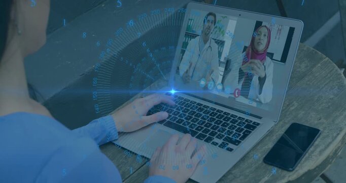 Patient typing on laptop, starting medical consult, blue overlay sweeping, two clinicians gesturing
