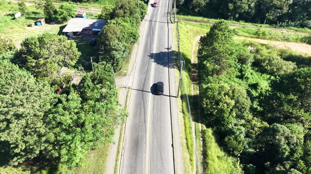 Aerial Top Down Tracking Black Car Crossing Railway Bridge