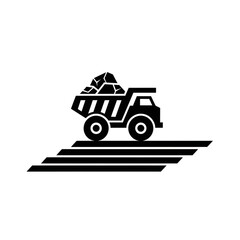 Silhouette of a Mining Dump Truck Carrying Rocks on a Road. © Whyy
