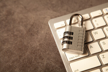 Locked padlock on a computer keyboard. Cyber security concept. © Artvibe