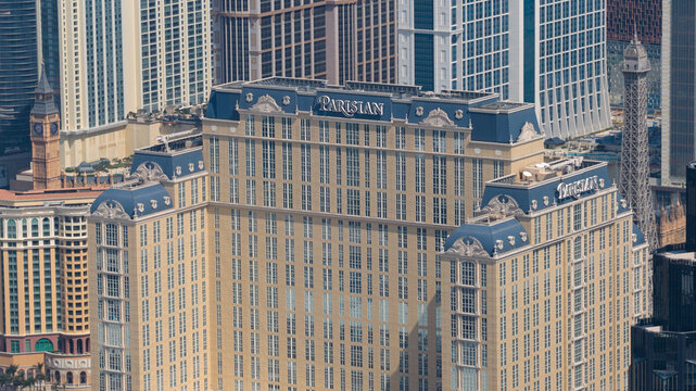 Taipa, Macao - 18 February 2026: Aerial view of the Parisian Macao's beige facade contrasted against the clear sky, an iconic landmark in the city's skyline.