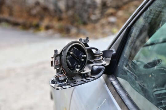 Damaged broken side mirror in a car. Result of minor car accident.