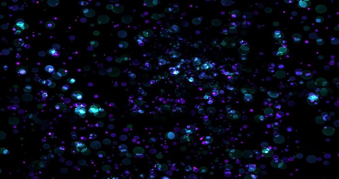 Bright dots of color dance and move across a dark background. The animation shows changing patterns and shapes that are lively