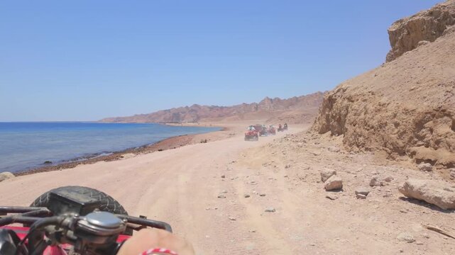 Driving a quad bike in the desert near Dahab, Egypt