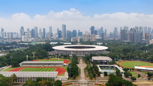 Gelora Bung Karno Main Stadium with a backdrop of tall buildings and blue sky in Jakarta, Indonesia on October 7, 2025.