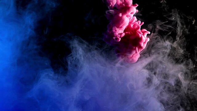 A video showcasing a mesmerizing display of colorful smoke swirling in the air