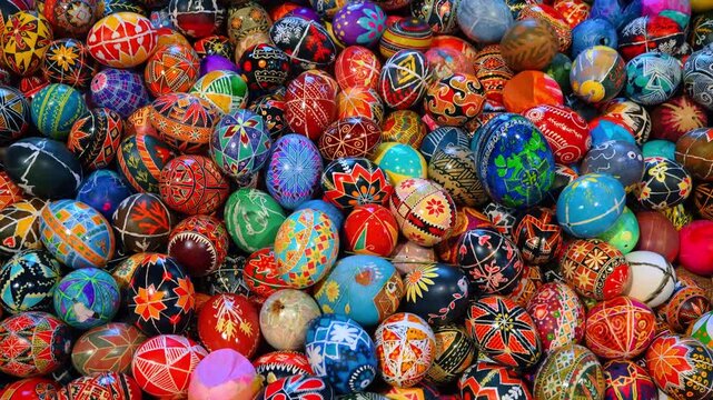 Vibrant display of hand painted Ukrainian Pysanky Easter eggs. Close-up of a large assortment of traditional Ukrainian Pysanky eggs with colorful geometric and floral motifs.