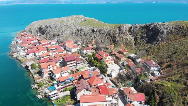 Village of Lin on the Rocky Peninsula Edge Along the Beautiful Shoreline of Lake Ohrid surrounded by emerald calm waters